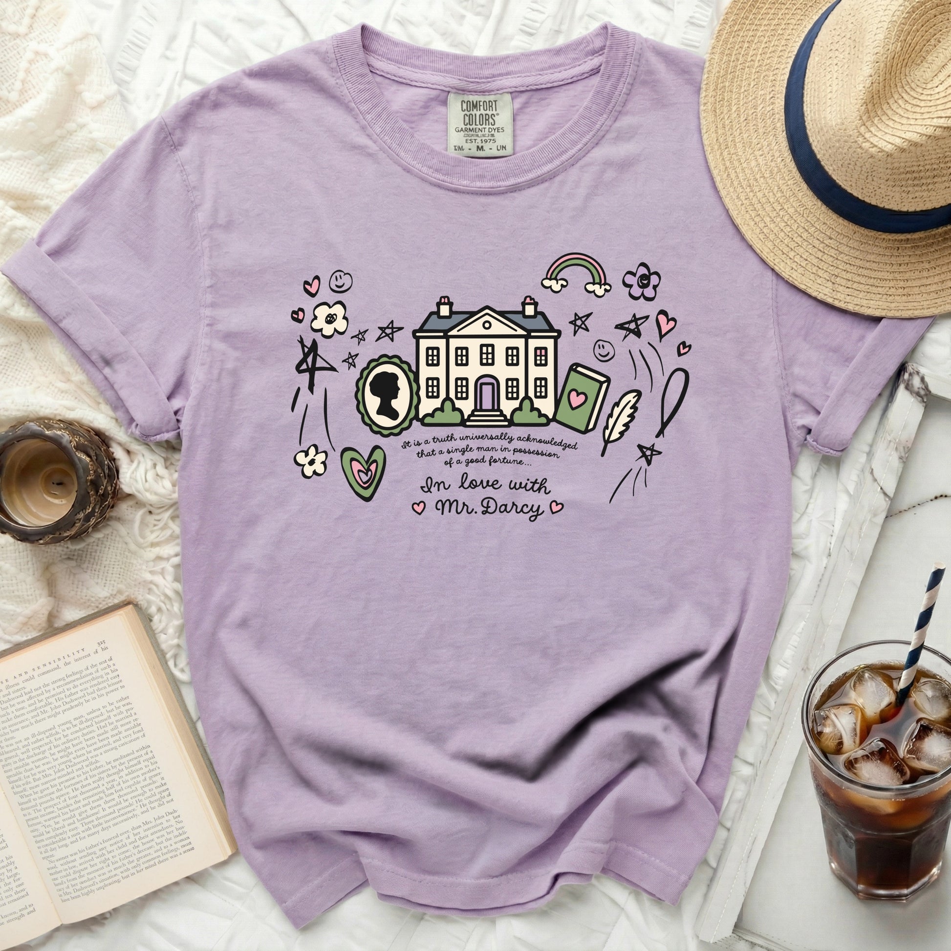 Purple Comfort Colors shirt with cartoon manor, book, quill, and "In love with Mr. Darcy."