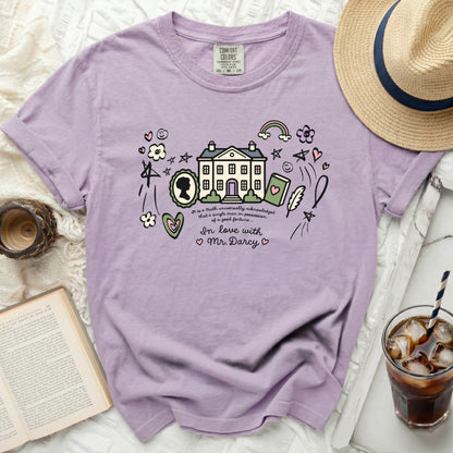 Purple Comfort Colors shirt with cartoon manor, book, quill, and "In love with Mr. Darcy."
