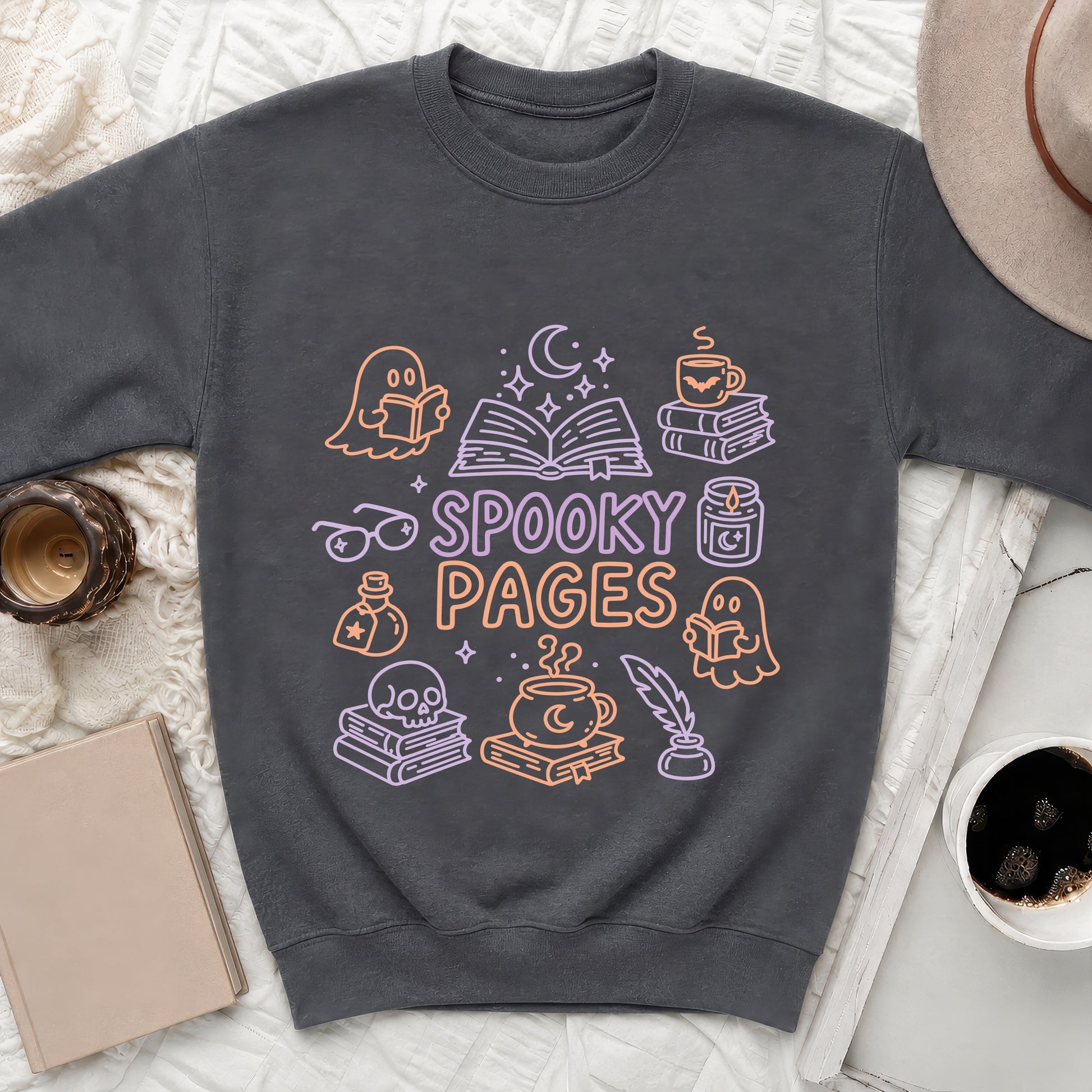 Dark grey sweatshirt with "Spooky Pages" text and Halloween-themed book illustrations.