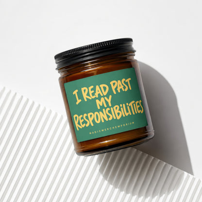 Amber candle with green label reading "I READ PAST MY RESPONSIBILITIES".