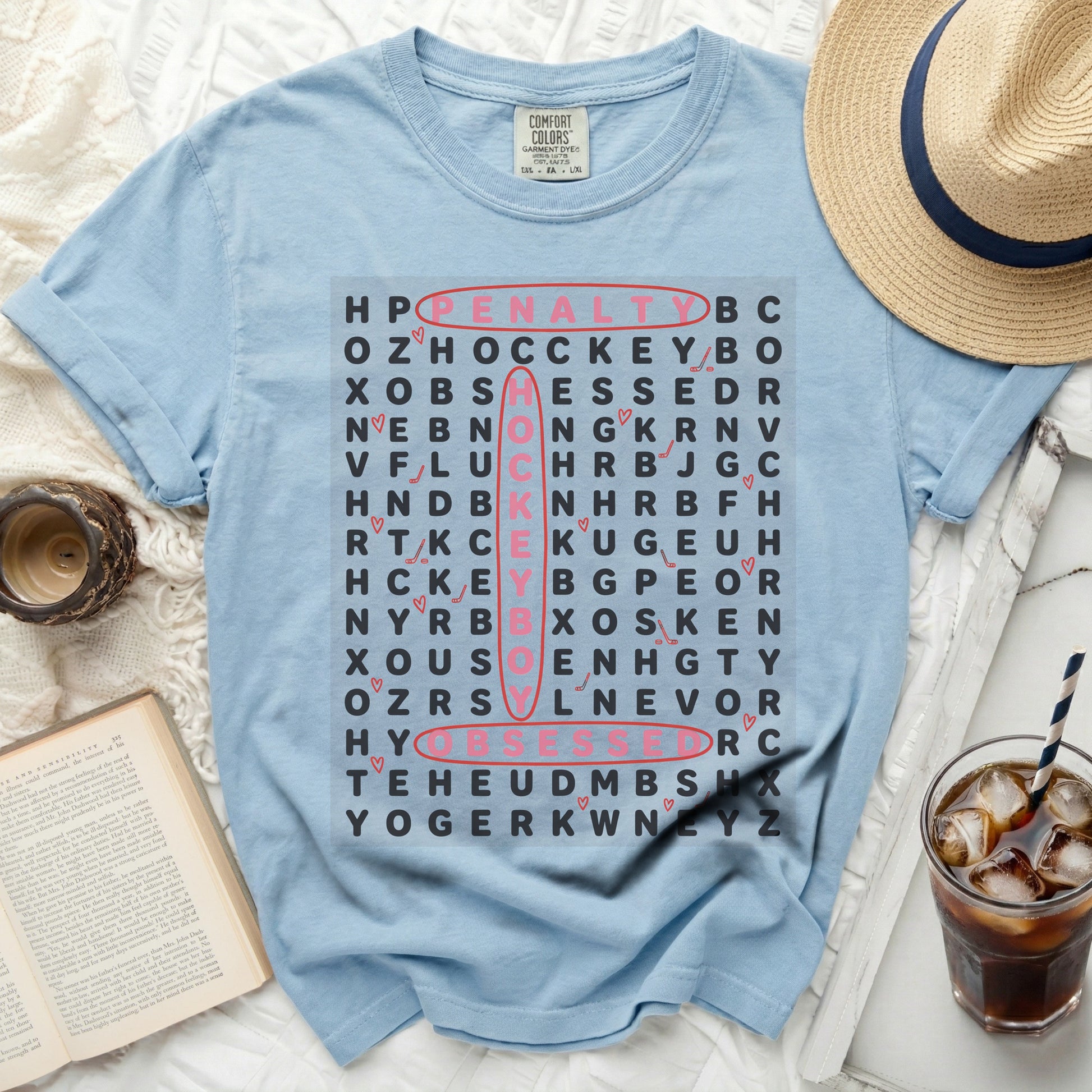 Light blue t-shirt with penalty and hockey word search grid.