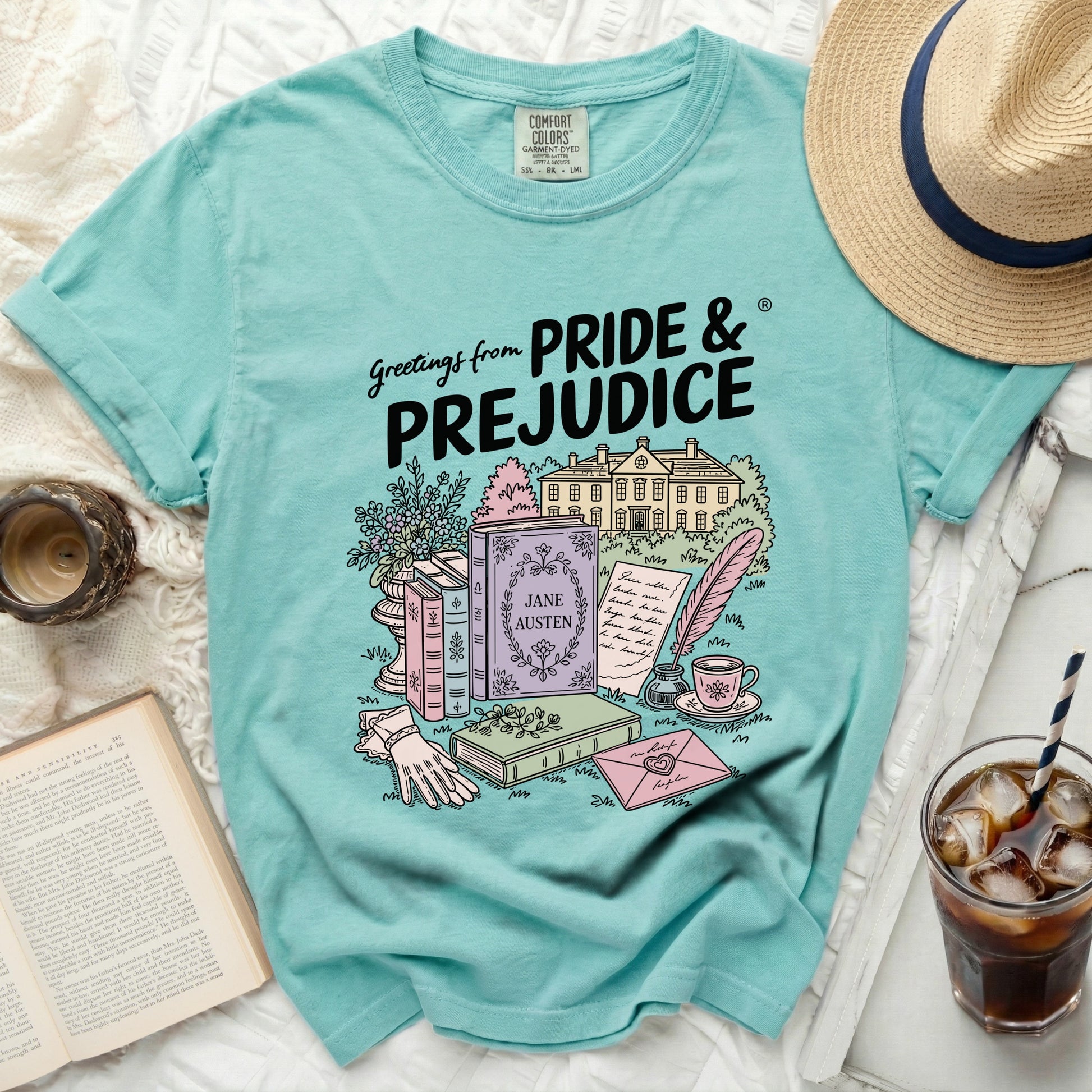 T-shirt with "Pride and Prejudice" book, house, Jane Austen book, and writing materials design.