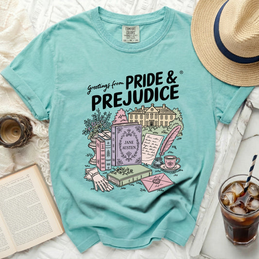 T-shirt with "Pride and Prejudice" book, house, Jane Austen book, and writing materials design.