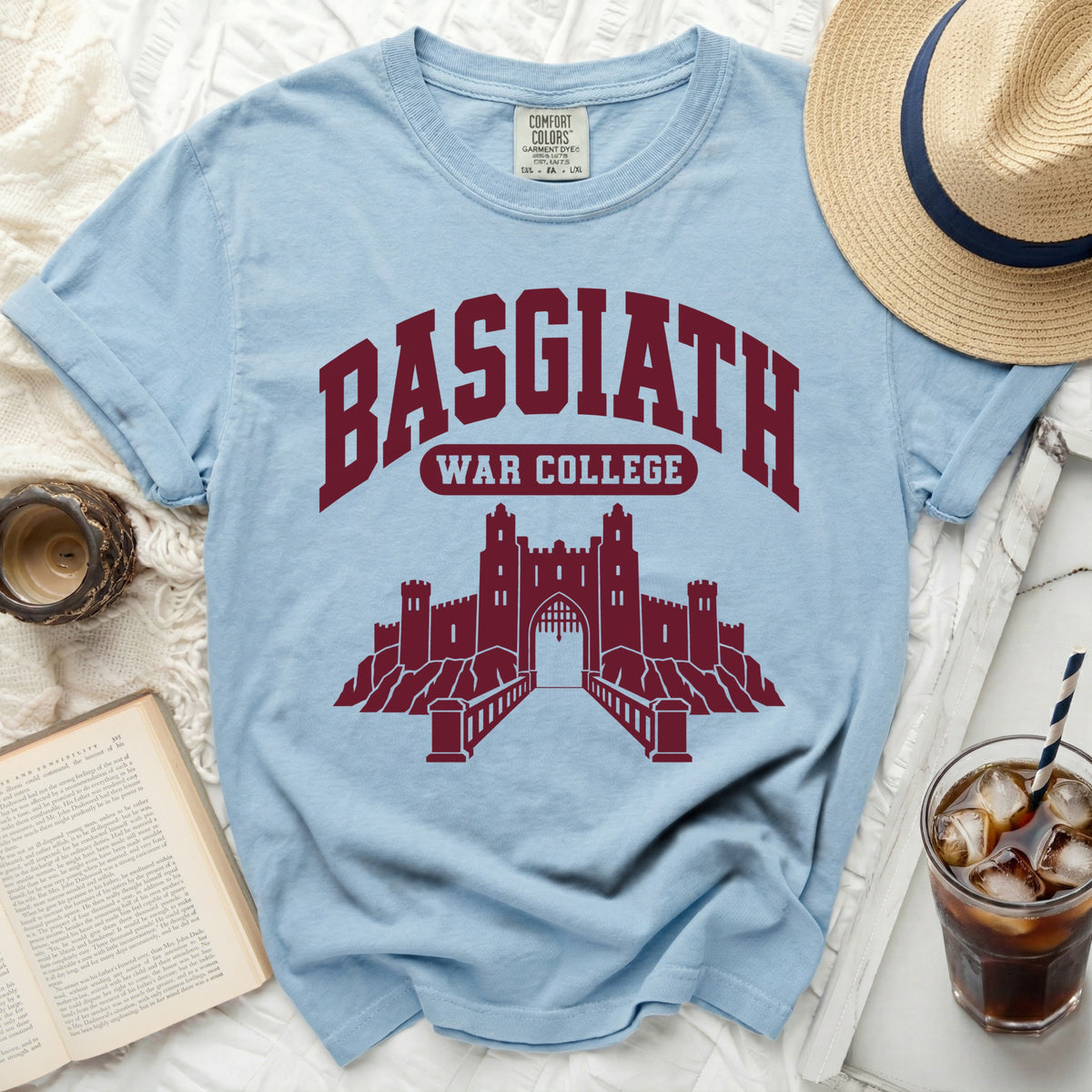 Light blue t-shirt with "BASGIATH WAR COLLEGE" text and castle graphic.