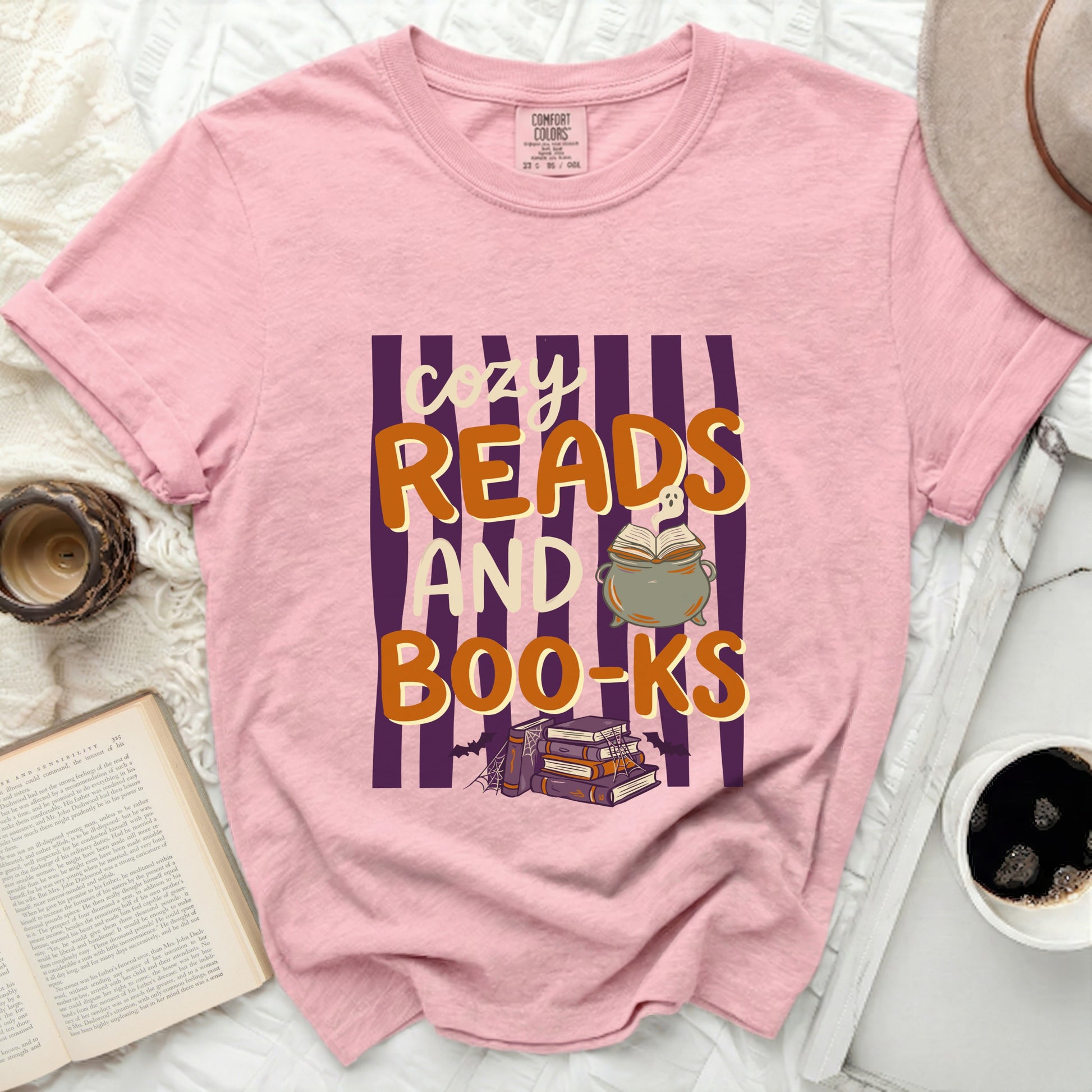 Pink t-shirt with "Cozy Reads AND Boo-Ks" text and Halloween graphics.