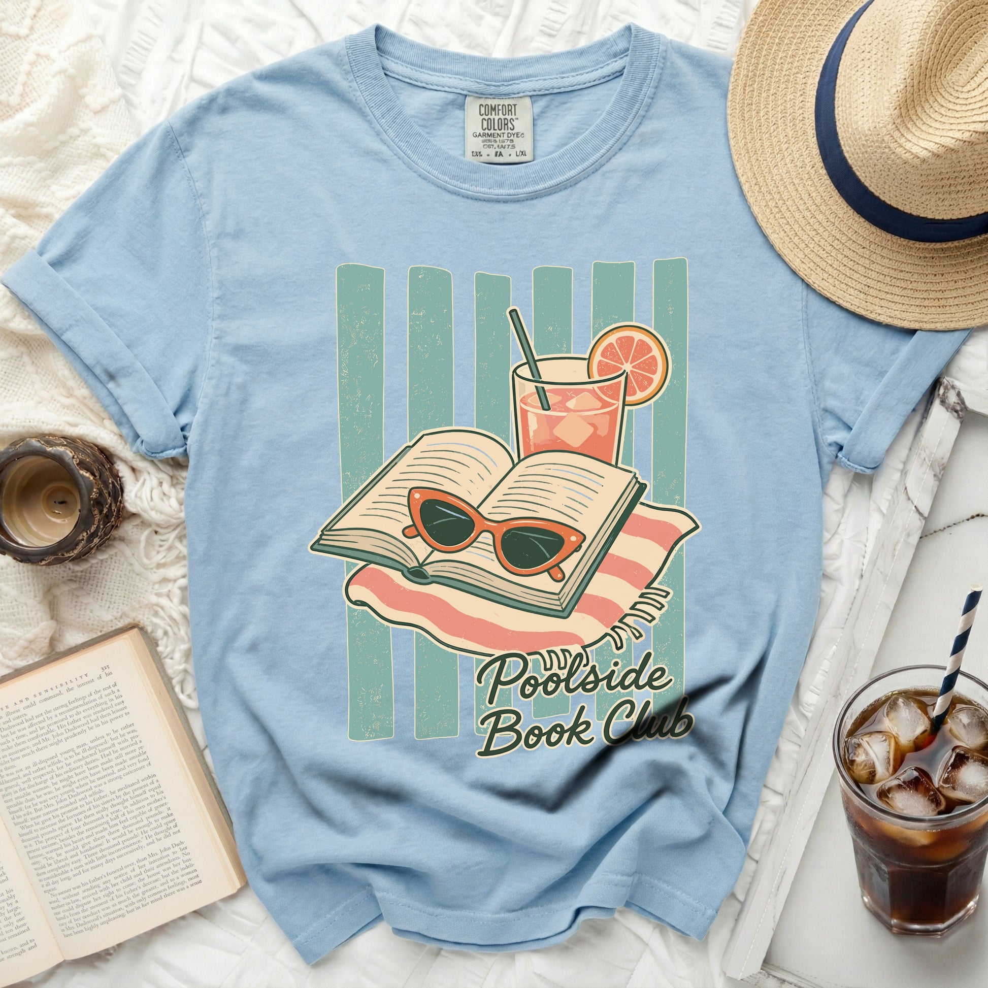 Light blue t-shirt with "Poolside Book Club" text and graphic.