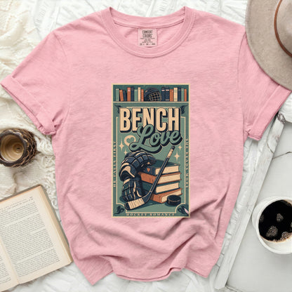 Pink t-shirt with "Bench Love" hockey romance graphic.