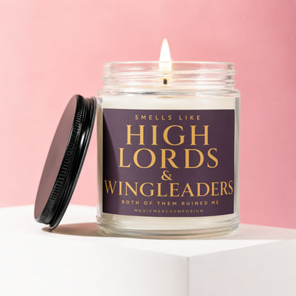 Lit candle in a jar with a purple label reading "Smells Like High Lords & Wingleaders".