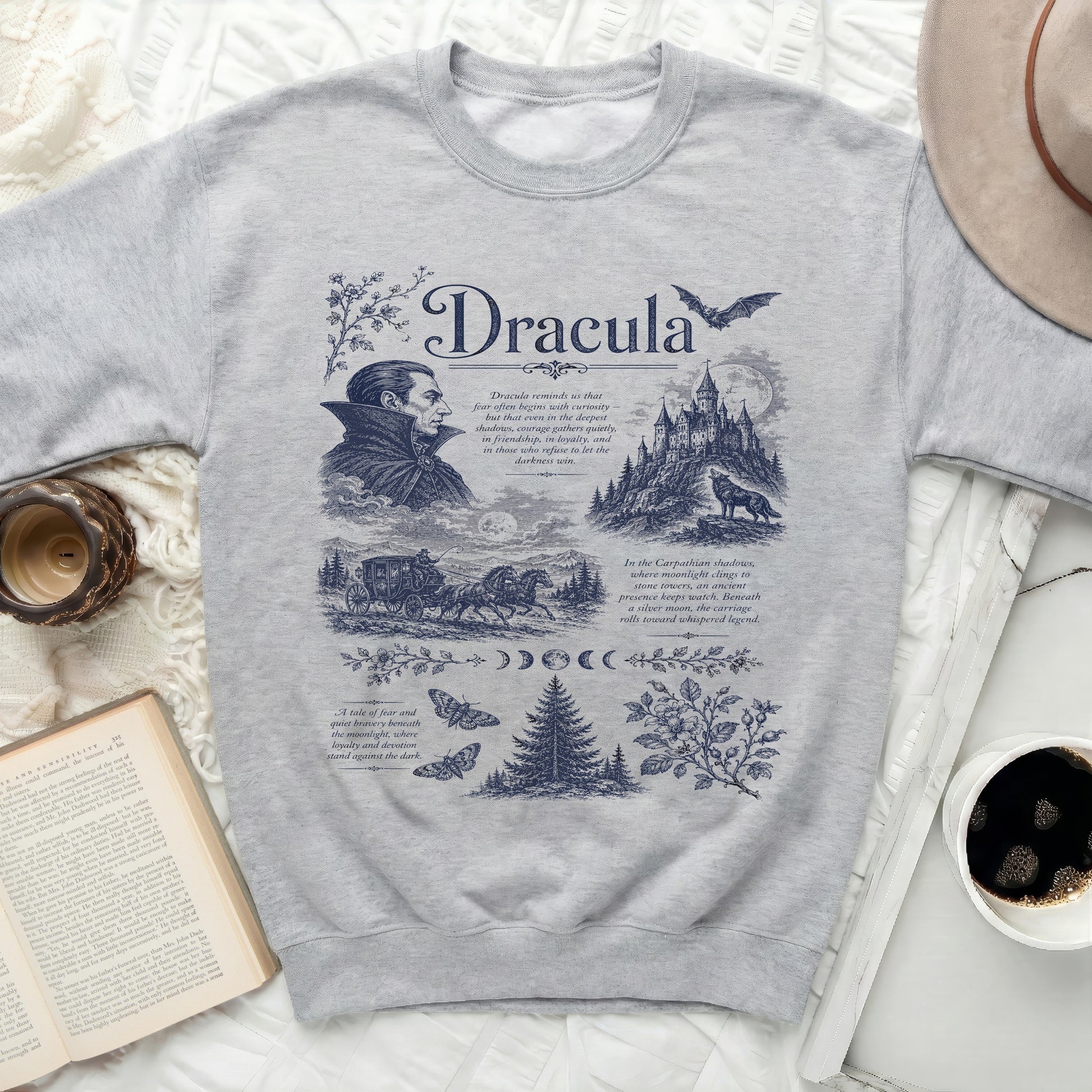 Grey sweatshirt with blue graphic including Dracula, castle, carriage, and text.