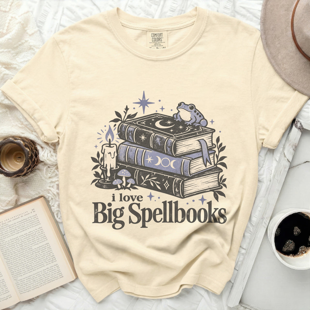 Cream t-shirt with "i love Big Spellbooks" text and a stack of spellbooks.