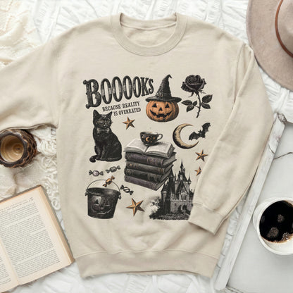 Light beige sweatshirt with Halloween-themed print: books, cat, pumpkin, castle.