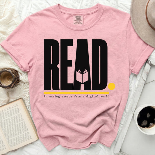 Pink t-shirt with "READ An analog escape from a digital world" text.