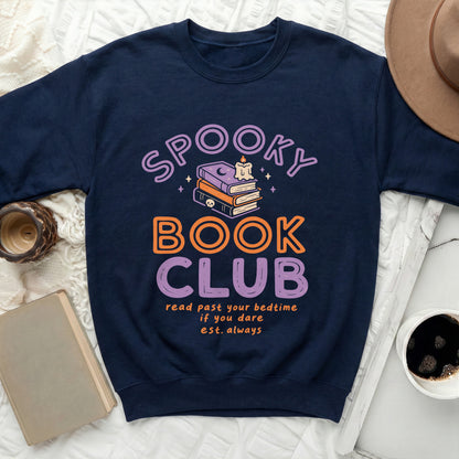 Dark blue sweatshirt with "Spooky Book Club" text and spooky illustrations.