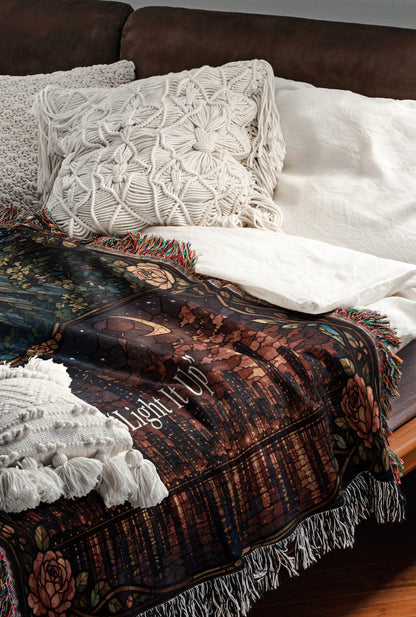 a cozy and inviting bedroom scene, featuring a bed with a colorful blanket and pillows, a wooden headboard, and a brown leather couch.