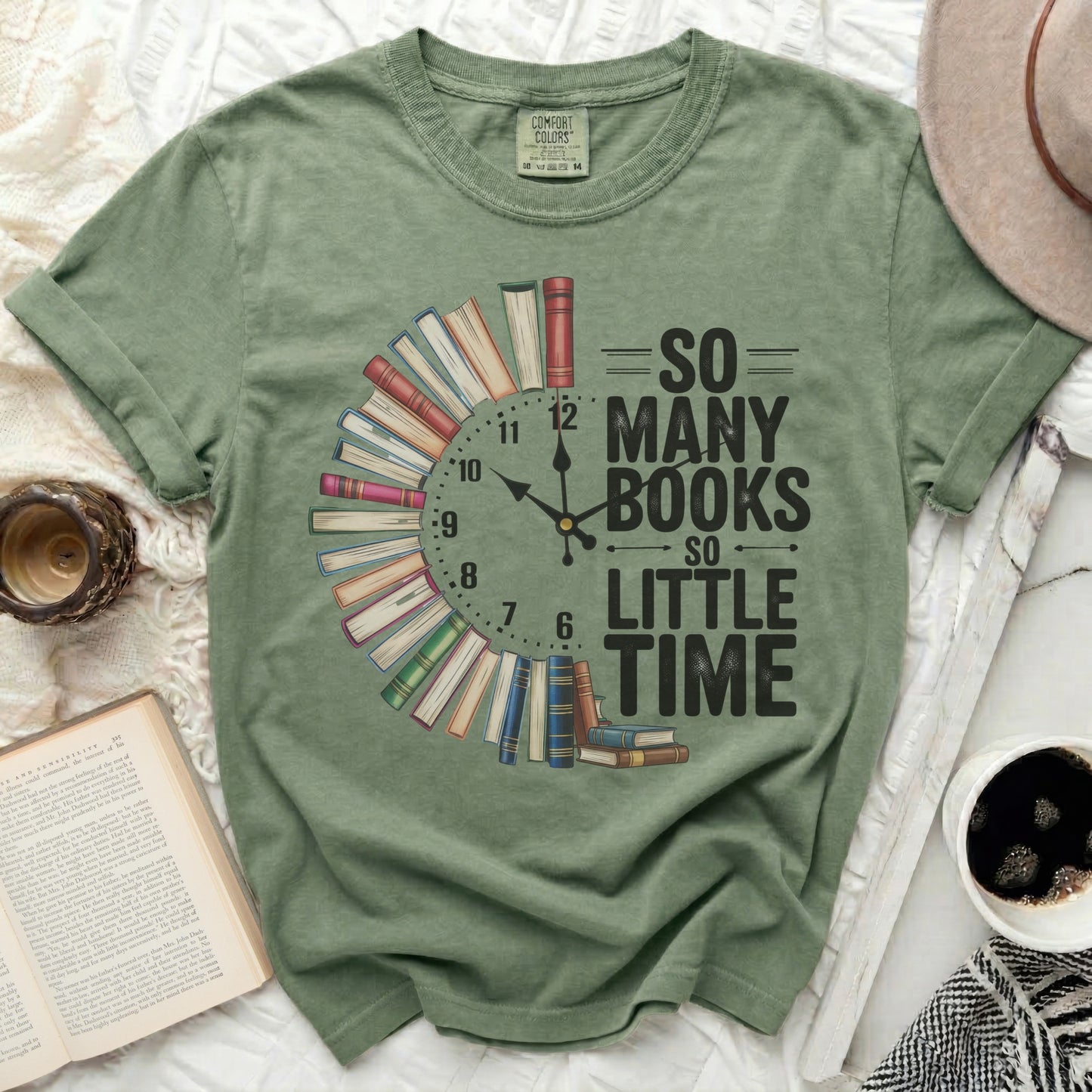 Green t-shirt with "So Many Books So Little Time" text and book clock design.