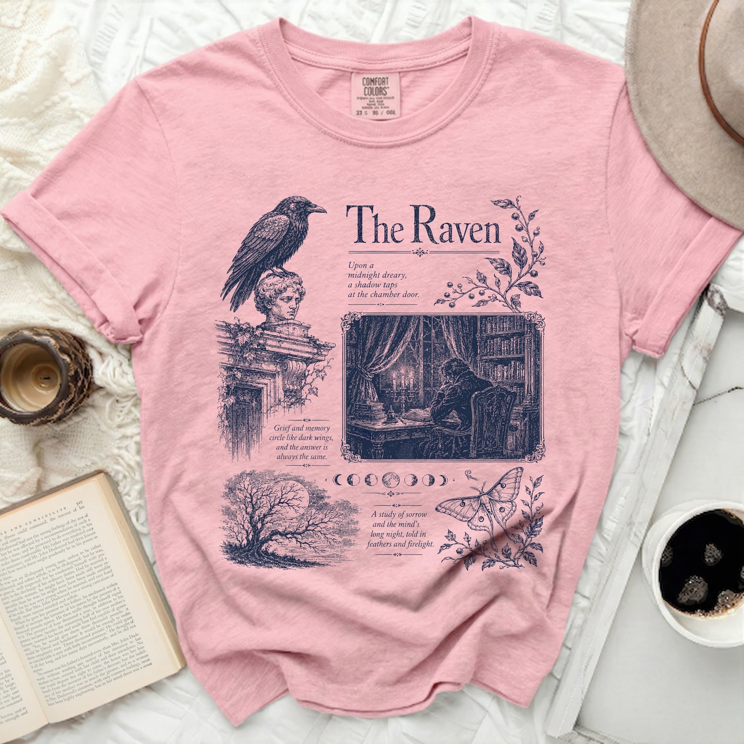 Pink t-shirt with "The Raven" design featuring moon phases, a moth, and literary quotes.