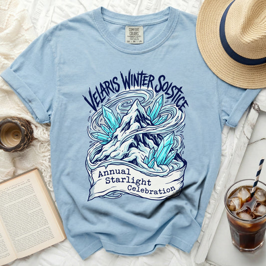 Light blue t-shirt with Velaris Winter Solstice graphic and text.