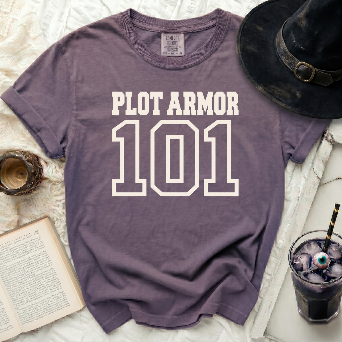 Purple t-shirt with "PLOT ARMOR 101" in white block letters.