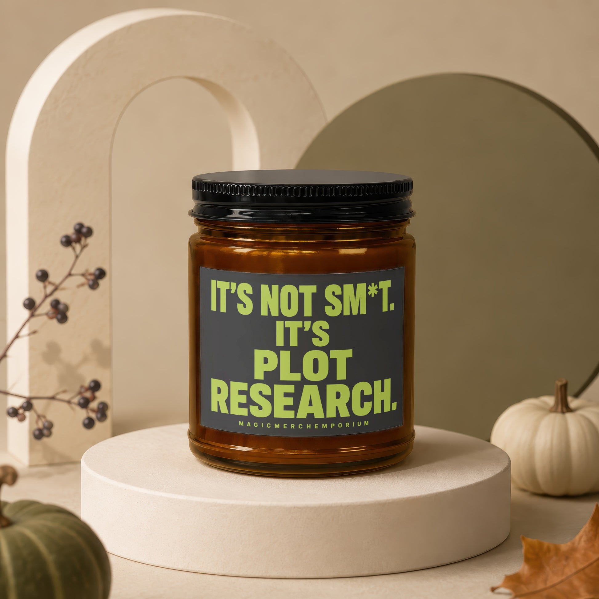 Amber jar candle with black lid reading "It's not sm*t. It's plot research."