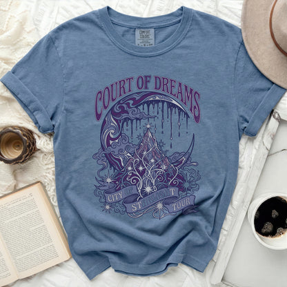 Blue t-shirt with "Court of Dreams City of Starlight Tour" text and celestial graphic.
