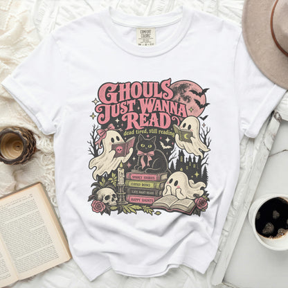 White t-shirt with "Ghouls Just Wanna Read" graphic featuring ghosts, a cat, books, and Halloween elements.