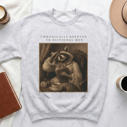 Light grey sweatshirt with "Chronically Devoted to Fictional Men" and raccoon in vintage style.
