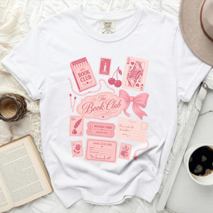 Book Club graphic on a white Comfort Colors t-shirt with card and pink details.