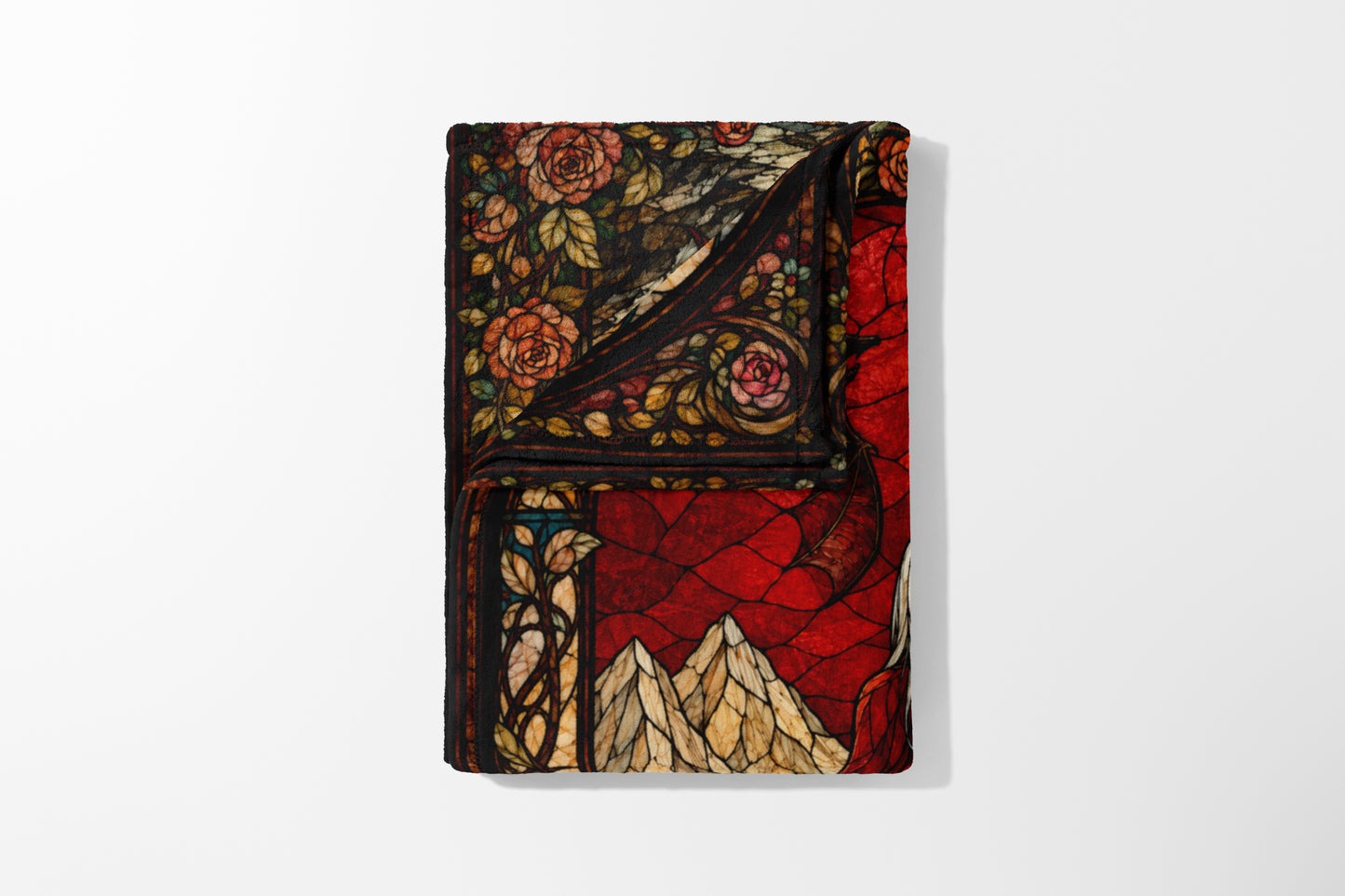Fleece blanket with a stained-glass design of roses and mountains.