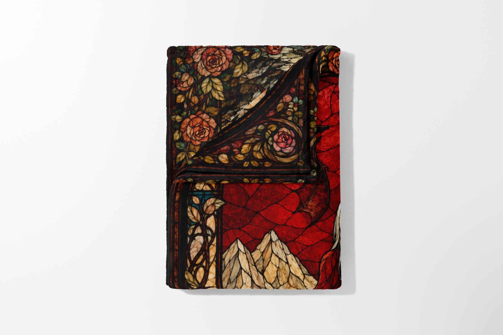 Fleece blanket with a stained-glass design of roses and mountains.