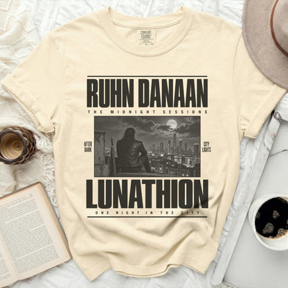 Cream t-shirt with "RUHN DANAAN THE MIDNIGHT SESSIONS LUNATHION" text and graphic.