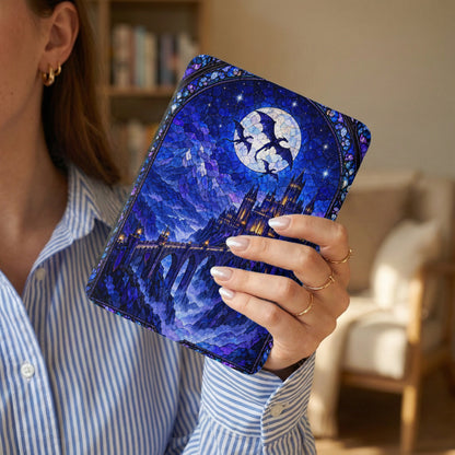 A woman holds a blue e-reader case featuring a stained glass-style fantasy castle design.