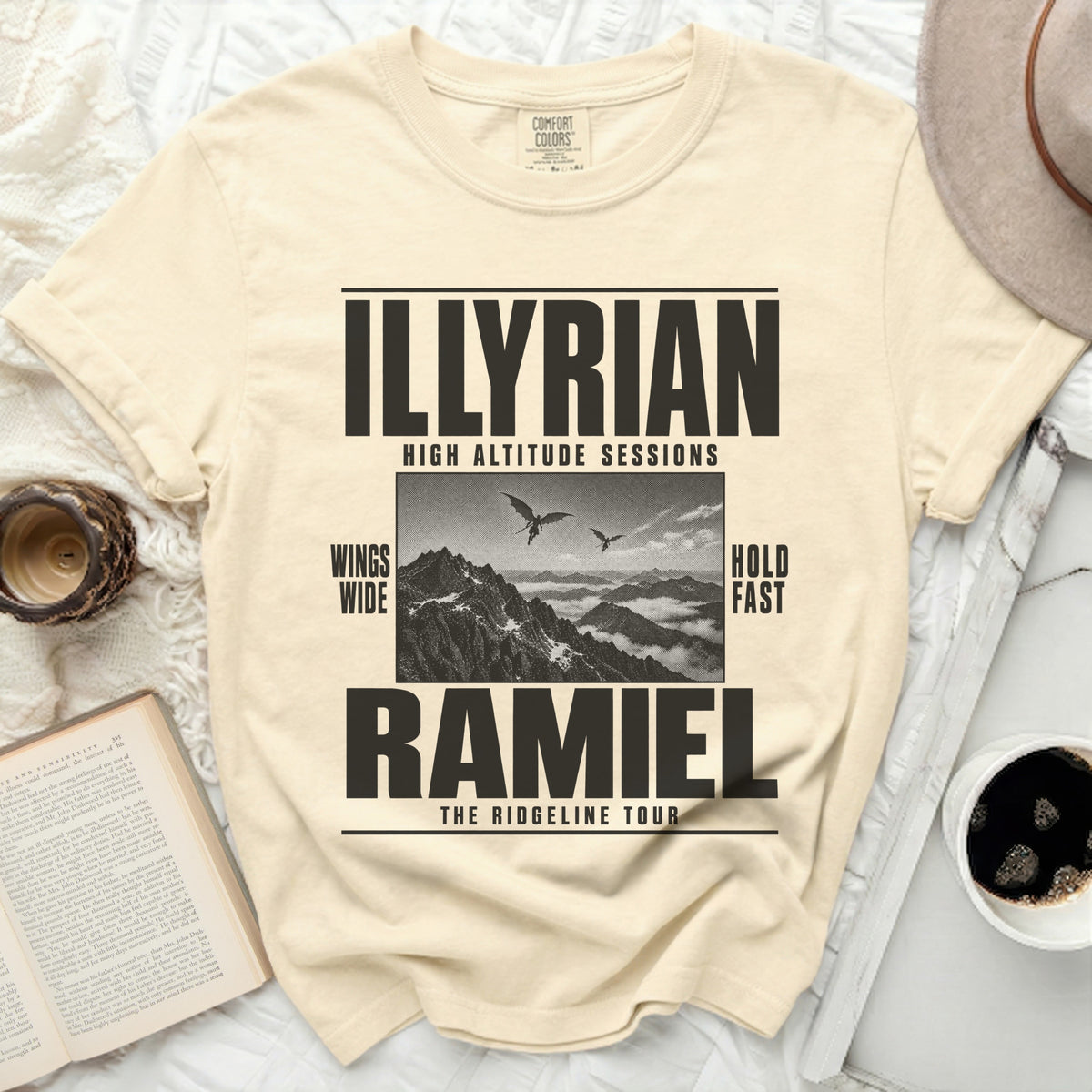 T-shirt with "Illyrian High Altitude Sessions Ramiel The Ridgeline Tour" text and mountain graphic.
