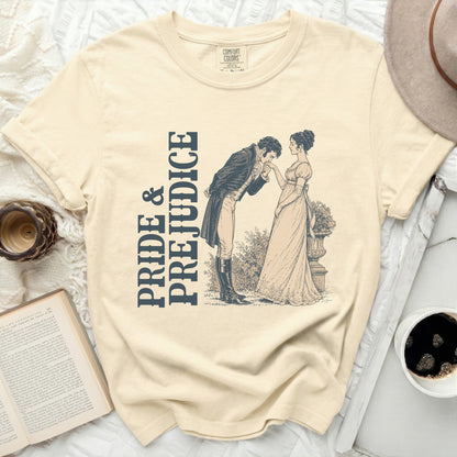 Cream t-shirt with "Pride & Prejudice" text and vintage illustration.