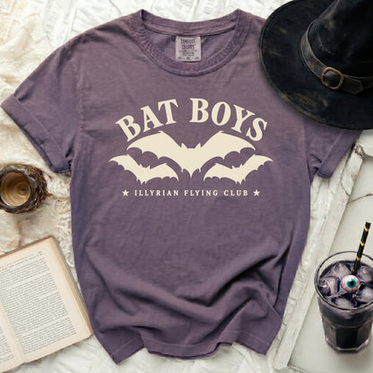 Purple t-shirt with "BAT BOYS" and "ILLYRIAN FLYING CLUB" text and bat graphics.