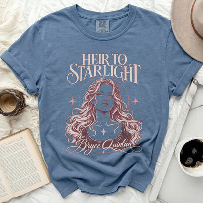 Blue t-shirt with "Heir to Starlight Bryce Quinlan" text and illustrated woman.