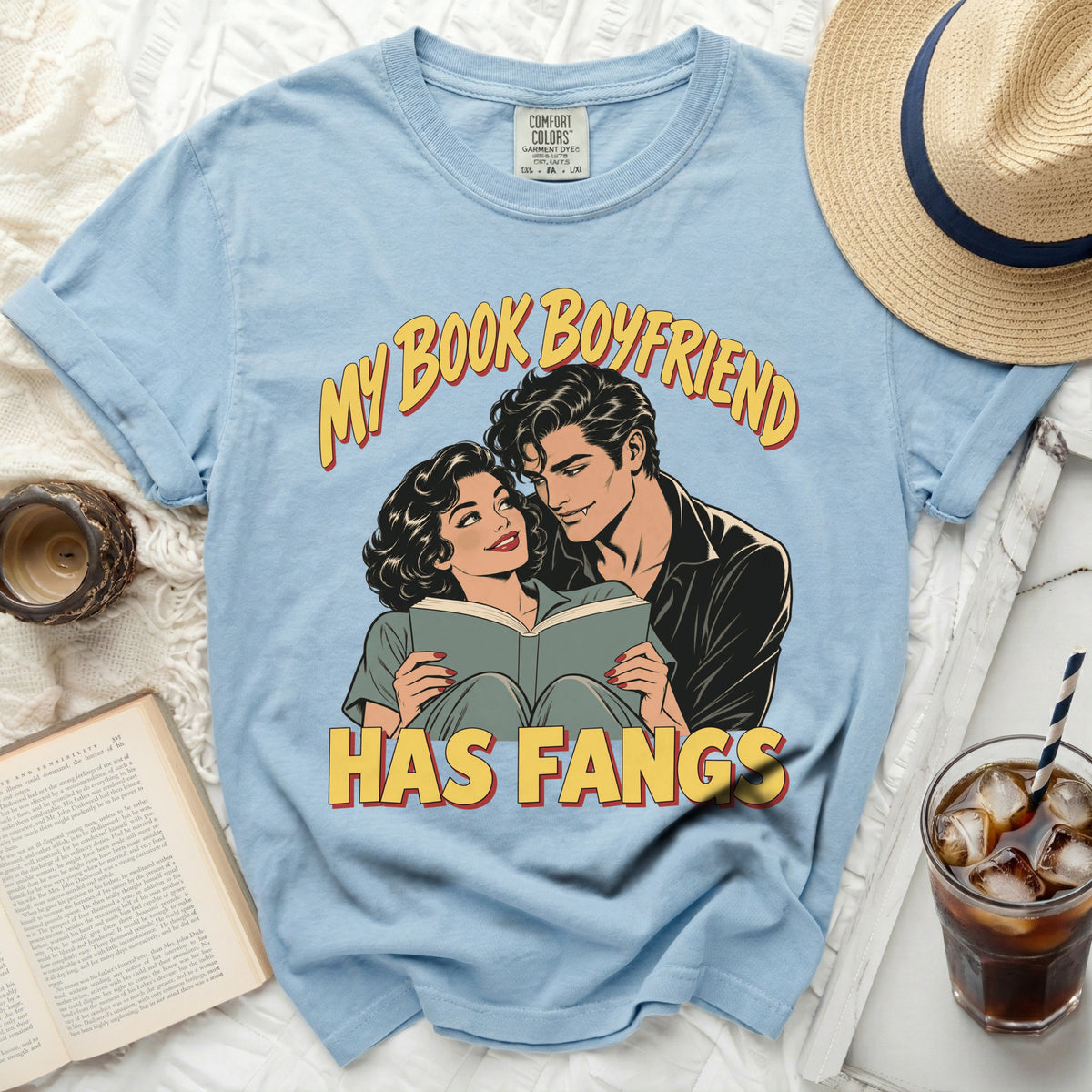 Light blue t-shirt with "My Book Boyfriend Has Fangs" comic-style graphic.