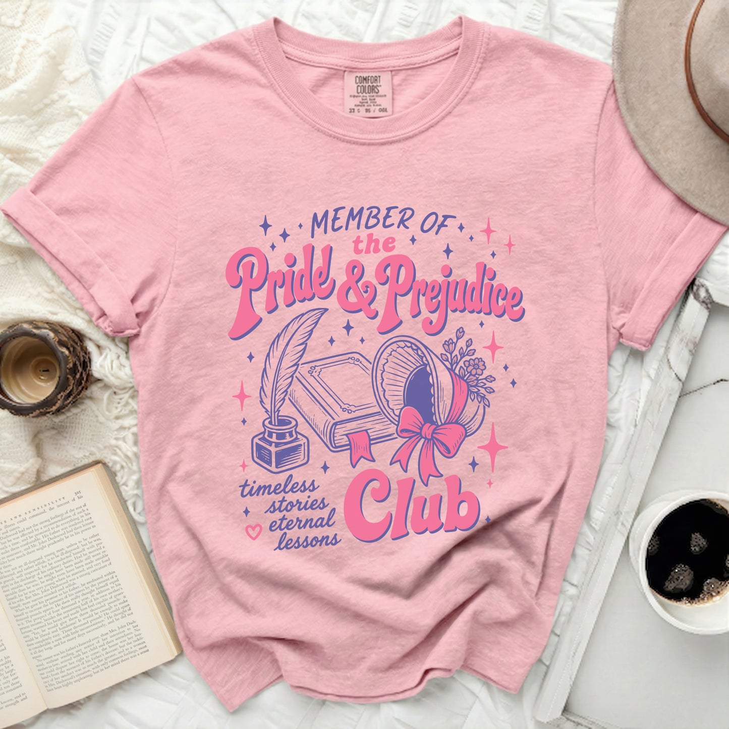 Pink Comfort Colors t-shirt with "Member of the Pride & Prejudice Club" graphic.