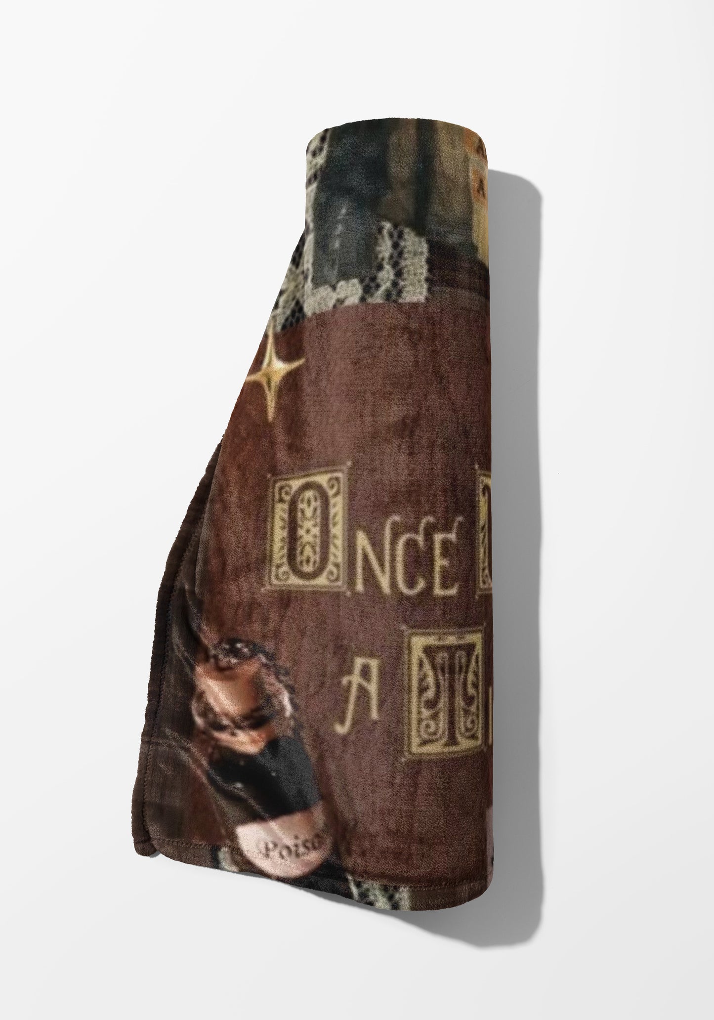 Rolled blanket with brown velvet texture, featuring "Once A..." text and a poison bottle.