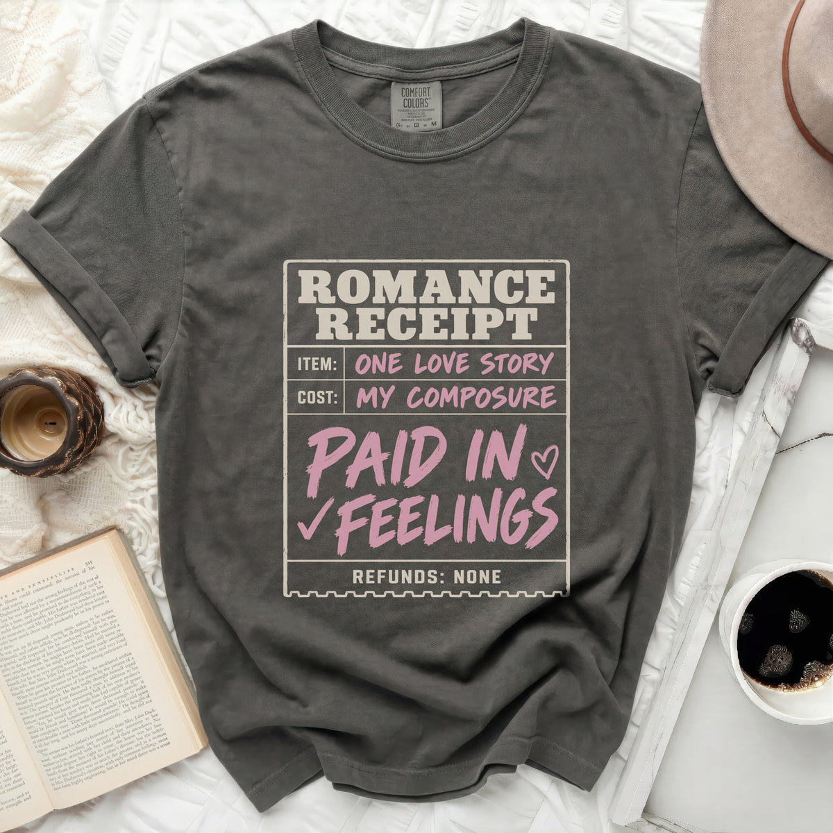 Gray t-shirt with "Romance Receipt" graphic: Item: One Love Story, Cost: My Composure, Paid in Feelings, Refunds: None.