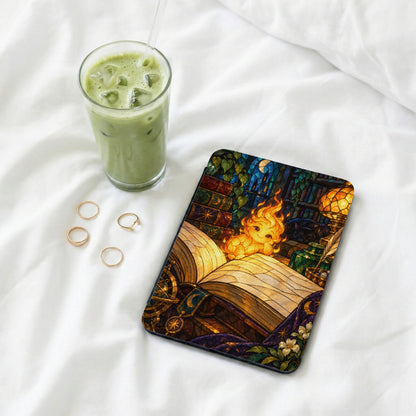 Case with open book, fire creature, sleeping cat, and stained glass window art.