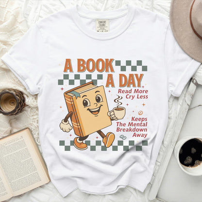 A book graphic with text "A BOOK A DAY Read More Cry Less Keeps The Mental Breakdown Away".