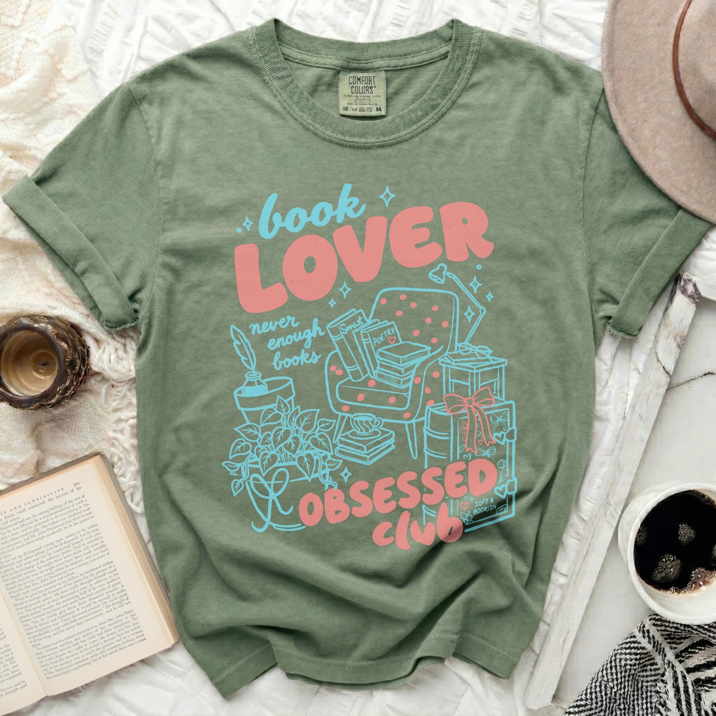 Green t-shirt with "book LOVER" and "OBSESSED CLUB" text and illustrations.
