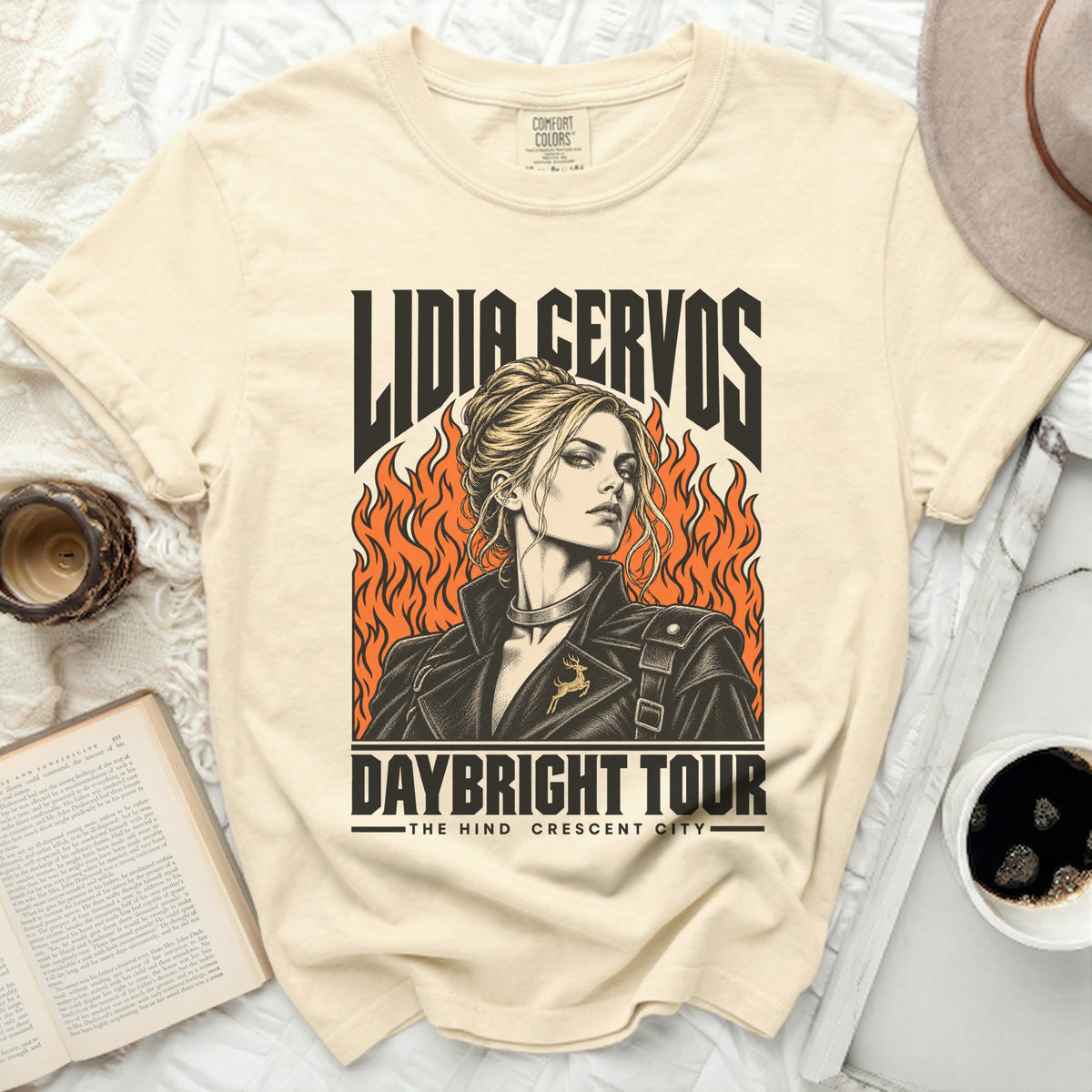 Cream t-shirt with Lidia Cervos Daybright Tour graphic featuring a woman and flames.
