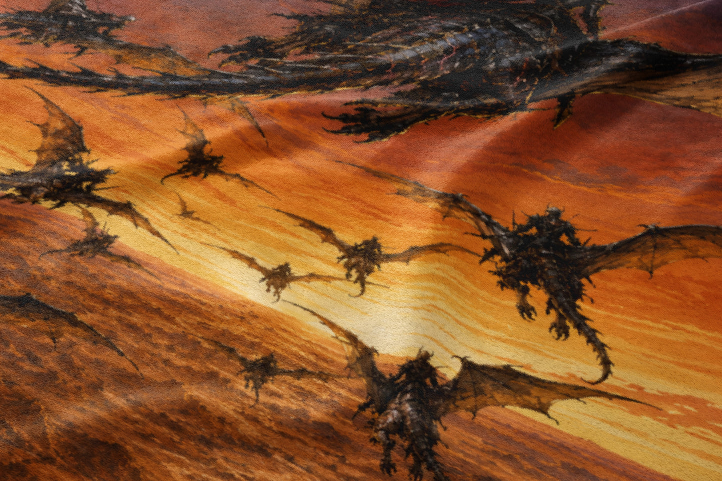 Several dark, winged dragons fly across an orange and yellow streaked background.