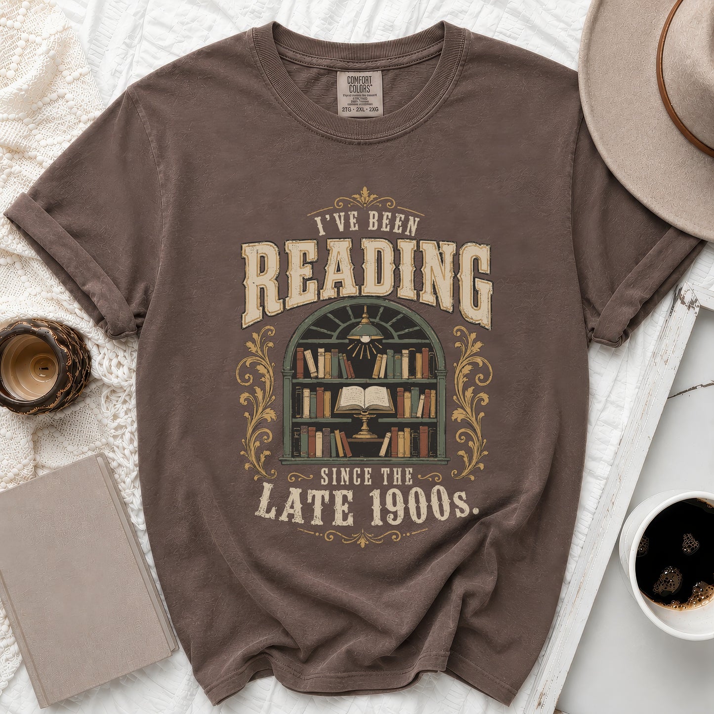 Brown t-shirt with "I've Been Reading Since The Late 1900s" graphic.