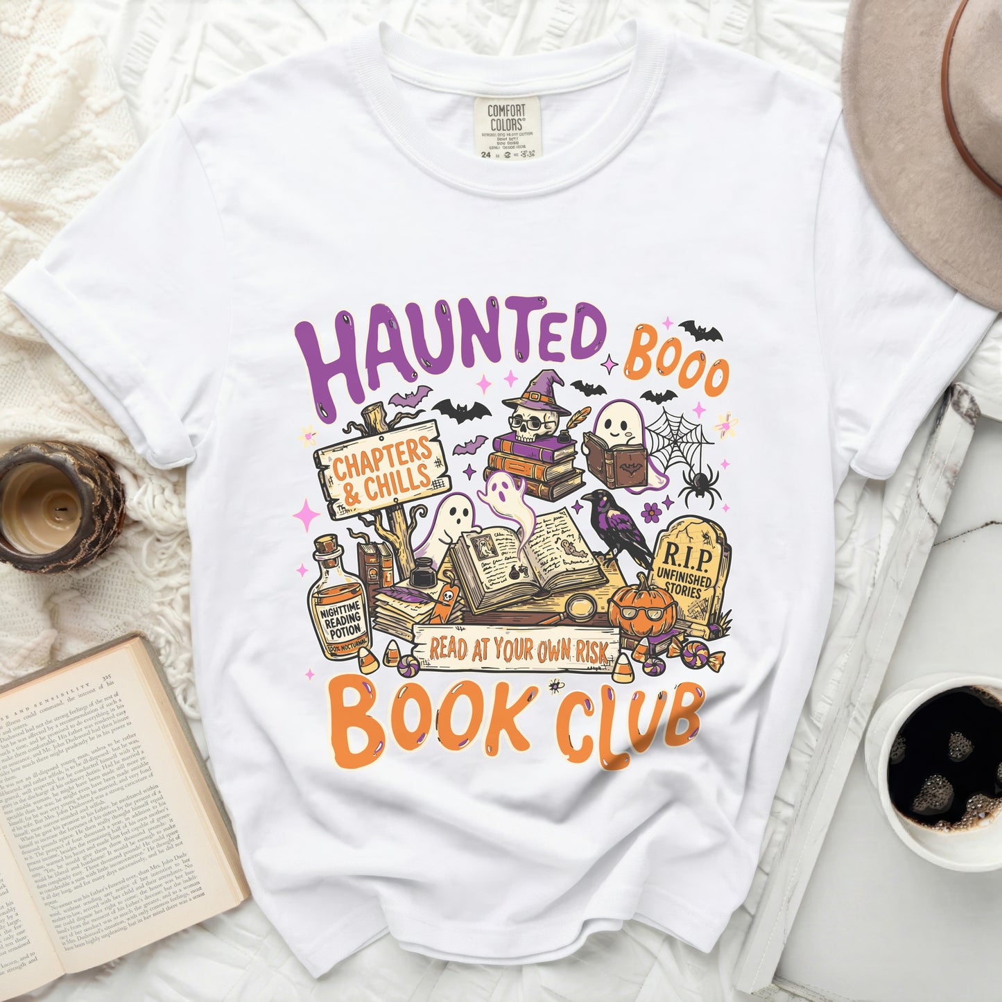 White t-shirt with "Haunted Book Club" Halloween graphic.