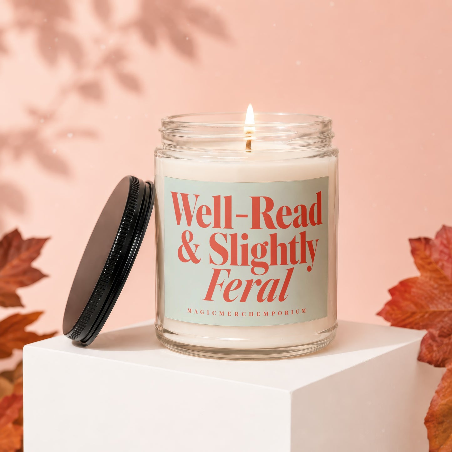 Candle with "Well-Read & Slightly Feral" text on label.