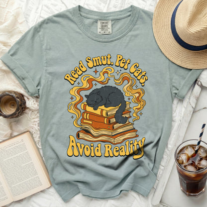 Read Smut. Pet Cats. Avoid Reality graphic on a t-shirt.