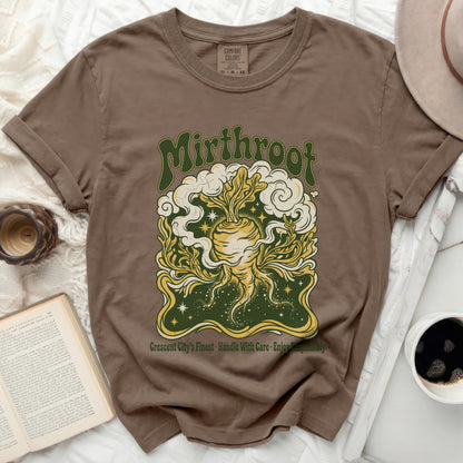 Brown t-shirt with circular graphic of root vegetable, clouds, and stars.
