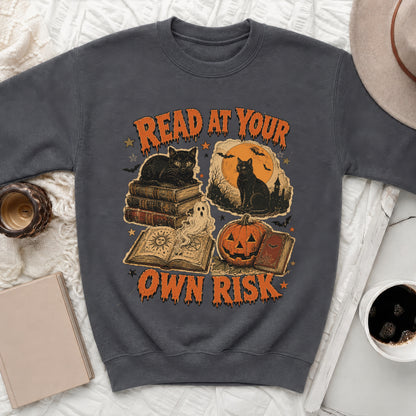 Graphic tee with text "Read at Your Own Risk" and Halloween imagery.